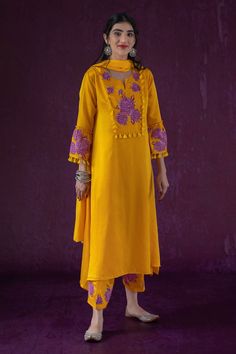 Yellow full sleeve straight fit kurta, elevated with rose patch work and tassel ornamentation. Comes with dupatta and pant.
Components:3
Pattern:Applique,Threadwork
Type of Work:Floral
Neckline:Round Neck
Sleeve Type:Full Sleeves
Fabric:Cotton Satin
Color:Yellow
Other Details:
Tassel bodice
Rose applique sleeves
Occasion:Puja,Mehendi and Haldi - Aza Fashions Cotton Long Sleeve Palazzo Set With Gota Work, Cotton Palazzo Set With Gota Work And Long Sleeves, Long Sleeve Cotton Palazzo Set With Gota Work, Festive Long Sleeve Unstitched Suit With Gota Work, Unstitched Long Sleeve Suit With Floral Embroidery For Navratri, Eid Long Sleeve Palazzo Set With Gota Work, Navratri Long Sleeve Unstitched Suit With Floral Embroidery, Unstitched Suit With Floral Embroidery For Navratri, Bollywood Lawn Suit With Gota Work And Long Sleeves