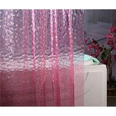 pink curtains are hanging on the side of a wall next to a vase with flowers