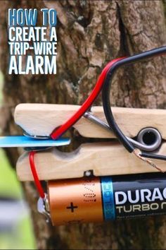 an electric device attached to a tree with the words how to create a trip - wire alarm