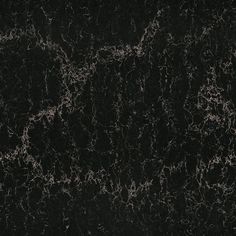 a black marble textured background with white streaks