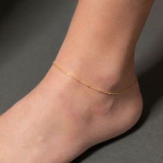 The perfect accent, this anklet features a dainty sterling silver chain in plain silver or plated in thick 18k yellow or rose gold (a.k.a. “Gold Vermeil*”) or gunmetal with tiny sterling silver cubes that catch the light as you move and really shimmer!Each piece comes in a beautifully branded gift box or velvet baggie - ready for gifting.This listing is for a single anklet.Nickel-free. Lead-free.*Gold Vermeil is the thickest possible (2.5 microns) 18k gold plating over sterling silver to give yo Anklet Bracelet Gold, Gold Anklet Aesthetic, Gold Anklets Indian Simple, Anklet Jewelry Gold, Gold Anklet Designs, Anklet Aesthetic, Simple Gold Anklet, Gold Ankle Bracelets, Gold Ankle Chain