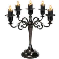 a black candelabra with seven lit candles