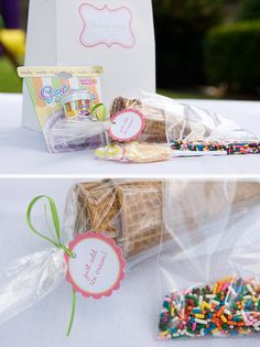 the table is set up for a birthday party with colorful sprinkles on it