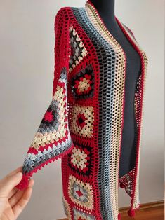 Red Bohemian Crochet Cardigan, Bohemian Red Crochet Cardigan, Red Bohemian Crochet Outerwear, Red Knitted Outerwear, One Size Red Knitted Outerwear, Red Crochet Long Sleeve Cardigan, Red Bohemian Cardigan With Crochet Details, Red Crochet Long Sleeve Outerwear, Handmade Red Outerwear For Fall