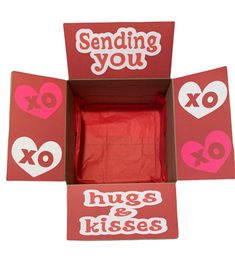 two boxes with stickers on them that say, sending you hugs and kissess