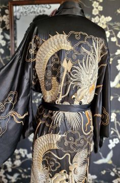 Oh I do love a dragon kimono and this is a beauty! Made of a substantial satin silk  heavily decorated with goldwork embroidery and lined in soft black silk. This also has an original sash belt, which could do with some tlc, as it has worn seams and the embroidery is lifting. The robe itself is overall in lovely condition. There is the odd loose gold thread, which is certainly not detrimental. A small nibble to the hip area as photographed, but overall a show stopping item! Photographed on my UK Dragon Kimono, Goldwork Embroidery, Loose Kimono, Embroidered Kimono, Black Kimono, Kny Oc, Sash Belts, Sash Belt, Gold Work