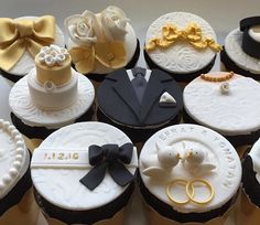 cupcakes decorated with different types of wedding rings and bow ties on top of each other