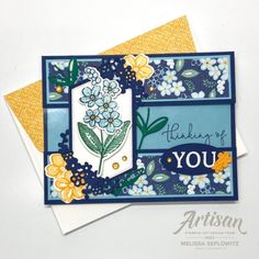 two cards with flowers on them, one is blue and the other has yellow accents