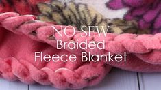 a close up of a blanket with the words no sew braided fleece blanket