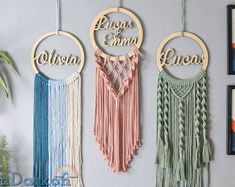 three wooden wall hangings with the word'love'written on them