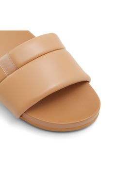 Quilted straps lend an extra touch of sophistication to this beautifully breezy slide sandal. Synthetic upper, lining and sole Imported Beige Open Toe Slides With Removable Insole, Elegant Brown Slides For Beach, Elegant Brown Beach Slides, Beach Slides With Adjustable Strap, Elegant Beach Slides With Cushioned Footbed, Comfortable Open Toe Slides With Adjustable Straps, Synthetic Open Toe Slides With Adjustable Straps, Open Toe Slides With Adjustable Straps, Spring Slide Sandals With Adjustable Straps