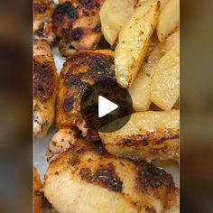 grilled chicken and pineapples on a white plate with a video player in the background