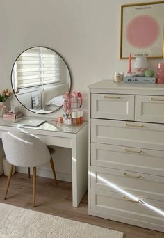 a white desk with a mirror on top of it