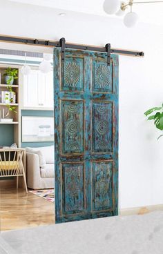 an old blue door is open in the living room