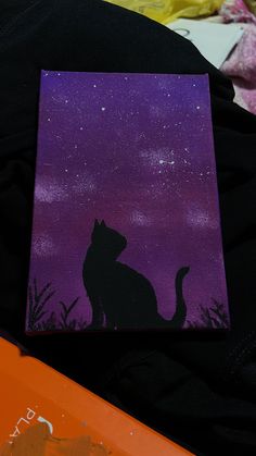 a painting of a cat sitting on top of a purple and black background with stars in the sky