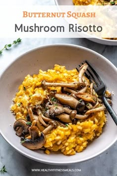 a bowl filled with mushroom risotto next to a fork