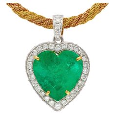 Jewelry Details: Item Type: Pendant Metal Type: 18K White Gold Gemstones: Green Emerald, Diamond Weight: 16.54 grams (Total Weight) Center Stone Details: Gemstone: Green Emerald Carat: 43.99 Carats Emerald Measurements: 24.97 x 24.34 x 15.24 mm Cut: Heart Shape Color: Green Treatment: Insignificant Oil Certificate: GRS (Gem Research Swisslabs) Certificate Number: GRS2020-028042 Diamond Details: Quantity: 101 stones total Total Carat Weight: ~8 Carats Cut: Round-Brilliant Color: G-H Clarity: VS-S 1stdibs Jewelry, Jewelry Details, Emerald Pendant, Yellow Gold Chain, Green Emerald, Emerald Diamond, Emerald Green, Types Of Metal, Metallica