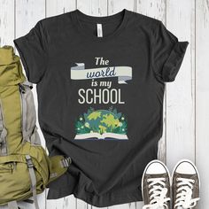 "Great Homeschool First day of School shirt for kids. This Worldschooler Wanderer Travel Shirt for Kids is the perfect gear for the first day of school for homeschooled adventurers! Whether they're worldschooling or learning outdoors, this shirt embodies the spirit of exploration and unschooling freedom. With the inspiring message \"The world is my school,\" it motivates young minds to embrace the vast opportunities for learning beyond traditional classrooms.  DESCRIPTION - Unisex Canva & Bella T-shirt - Soft and light - Solid colors are 100% Airlume combed and ring-spun cotton - Heather colors contain between 1% - 48% polyester depending on the color. - Design size might appear smaller on larger sizes If a color or size you want is sold-out or not listed, please reach out! RETURNS AND EXC Educational Letter Print T-shirt For School Events, Black T-shirt For Back To School, Back To School Short Sleeve T-shirt, Back To School T-shirt With Letter Print, Black T-shirt For Back To School Events, Educational T-shirt For Back To School Events, Homeschool Shirts For Kids, Homeschool T Shirt Ideas, Educational T-shirt For School Events And Back To School