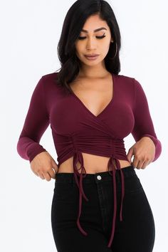 This sexy double drawstring long sleeved crop top is a must have for this season. It features a surplice neckline, ribbed knit fabric and a ruched look. The adjustable string shortens blouse to you liking. Buy one for your next date night or holiday event. Shop Black Friday/Cyber Monday for additional savings! Material: 92 % Polyester, 8% Spandex Neckline: Surplice V Neck Sleeve Length: Long Embellishments: Double drawstring, ribbed knit fabric Pattern: Solid Color: Burgundy, Mauve, Olive Size: Womens Denim Dress, Tie Crop Top, Surplice Neckline, Womens Cocktail Dresses, Cropped Tops, Cropped Style, Set Outfit, Plus Size Swimwear, Clothing Dresses