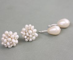 These earrings are made with beautiful freshwater pearls and sparkly crystals formed into a cluster with silver wire. This listing includes a removable large, AAA quality, teardrop freshwater pearl that can be slid onto the post for more of a statement look. Visit my shop for other bridal jewelry and accessories. http://www.etsy.com/shop/VirginiaGeigerJewels For bridesmaid jewelry, visit my other Etsy shop. http://www.etsy.com/shop/moderndesignsbyvkg Pearl White Cluster Earrings For Wedding, Pearl White Cluster Earrings With Pearl Drop For Wedding, Pearl White Wedding Cluster Earrings With Pearl Drop, Elegant Cluster Bridal Earrings For Wedding, Wedding Teardrop Pearl Drop Cluster Earrings, Wedding Teardrop Cluster Earrings With Pearl Drop, Cluster Bridal Earrings For Wedding, Sparkly Crystals, Teardrop Bridal Earrings