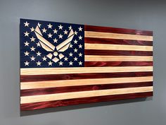 an american flag made out of wood with the eagle emblem on it's side