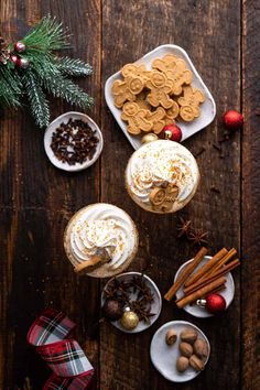 an overhead view of desserts on plates with christmas decorations and cookies in the background