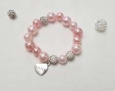 Custom Bracelet For KidsBaby BraceletsBaby Shower Gift Baby | Etsy Personalized Adjustable Sweet Style Jewelry, Sweet Personalized Adjustable Jewelry, Sweet Adjustable Personalized Jewelry, Cute Birthday Bracelets, Cute Round Stretch Bracelet As Gift, Hypoallergenic Pink Stretch Bracelet For Birthday, Personalized Round Bracelets, Cute Adjustable Pearl Bracelet Gift, Cute Pink Pearl Bracelet For Gift