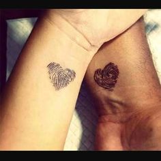 two people with matching tattoos on their arms