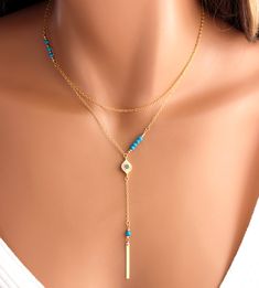 "This is a 925 sterling silver, multi strand Evil Eye Lariat Y style necklace! Genuine turquoise gemstones 3-4mm make this double strand necklace stunning! Necklace has a shorter choker length chain and a longer Y style chain with an evil eye center pendant with small pave blue crystals. A 1\" sterling silver bar pendant with a turquoise gemstone hangs from drop. Drop measures 3\" with bar pendant.ds This is stunning statement piece, makes a great gift for that unique lady! Comes nicely boxed, f Good Luck Necklace, Evil Eye Necklace Gold, Tiffany Jewelry, Cluster Necklace, Evil Eye Necklace, Multi Strand Necklace, Eye Necklace, Drop Pendant, Turquoise Gemstone