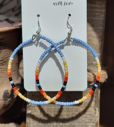 Unique beaded hoop earrings. Hand beaded with size 11/0 seed beads.  Silver wire closures. Very lightweight and easy to wear. Hoops have a diameter of 2 inches. The earring length is 2.75 inches. Beaded Hoop Earrings, Beaded Hoops, Jewelry Earrings Hoops, Hand Beading, Silver Wire, Seed Beads, Etsy Earrings, Porter, Hoop Earrings