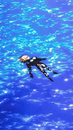 a person floating on top of a body of water