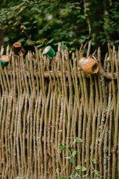 an old fence made out of sticks and bottles