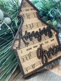 a wooden ornament with musical notes on it