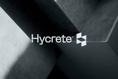 the hycrete logo is displayed on a black and white background with shadows