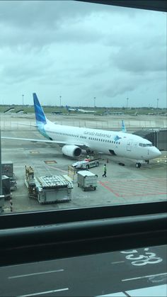 an airplane is parked at the airport terminal