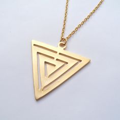 Huge matte gold triangle with a maze like pattern is suspended on a quality semi-matte gold plated chain. Choose your length from the drop down menu. The big gold plated triangle measures just over 2 inches from top to bottom. The gold plated chain has a lobster clasp, and extension chain.  This necklace comes in a gift box. Also now available separately in antique silver plated, and bronze. More triangles here: http://etsy.me/2q3vhDj Sterling Silver Mood Ring, Mood Stone, Crescent Earrings, Gold Triangle, Triangle Necklace, Triangle Pendant, Cameo Necklace, Geometric Triangle, Geometric Necklace