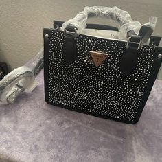 Guess Issa/ Alcey Mini Tote Bag Black With Rhinestones Comes With Crossbody Strap New With Tag And Protectors Luxury Black Rhinestone Shoulder Bag, Top Handle Shoulder Bag With Rhinestones For Everyday, Designer Leather Shoulder Bag With Rhinestones, Luxury Rhinestone Bags For Night Out, Glamorous Bags With Silver-tone Hardware And Top Handle, Glamorous Top Handle Bag With Silver-tone Hardware, Evening Black Bags With Rhinestone Rivets, Chic Silver Bags With Rhinestones, Rhinestone Shoulder Bag