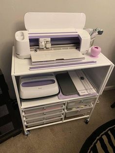 a sewing machine sitting on top of a white shelf