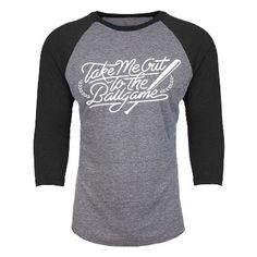 a grey and black baseball shirt with white lettering on the front that says take me out to the ballgame