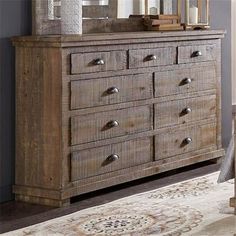 the dresser is made from wood and has many drawers