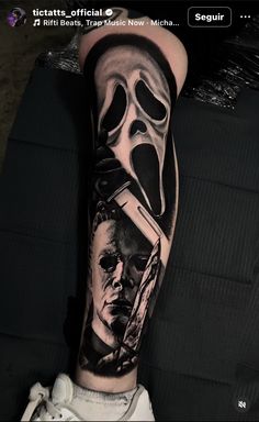 a man's arm with a tattoo on it that has an image of a person holding