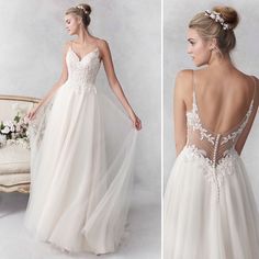 the back of a wedding dress with an open - back and floral appliques