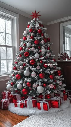 a decorated christmas tree with red and white ornaments