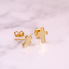 These elegant and minimalist cross stud earrings are crafted in your choice of 14k or 18k solid gold, available in yellow, rose, or white gold. Perfect for everyday wear or special religious occasions, these earrings make a thoughtful gift for baptisms, confirmations, first communions, or graduations. Offered in three sizes to suit your style, these dainty cross studs are a timeless addition to any jewelry collection. ✨ Perfect For: 🌼 Baptism 🙏 Confirmation  ✝️ First Communion 🎁 Easter 🎄 Christmas 💖 Meaningful Gift Order now to gift someone special--or yourself--a meaningful piece of jewelry that symbolizes faith and love. 💝 Material: Solid Gold (no gold filled or no gold plated material) Available Gold Karat: 14K (585), 18K (750) Available Gold Color: Yellow, Rose or White Available Gold Cross Earrings, Cross Stud Earrings, Cross Earrings Studs, Tiny Cross, Evil Eye Earrings, Confirmation Gifts, Eye Earrings, Birthstone Earring, Earrings Minimalist