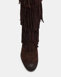 Upgrade your wardrobe with the SPUR fringe boot. These boots feature a fringe detailing that adds a touch of effortless style. Perfect for any occasion, these boots will elevate your look while providing comfort and durability. 1 inch heel height 14.5 inch shaft circumference 15 inch shaft height Suede upper material Synthetic lining Leather sock Synthetic sole Fit tip: If you are in between sizes, size up a half-size Imported Winter Suede Boots With Tassels, Western Fringe Boots For Fall, Brown Fringe Winter Boots, Leather Fringe Boots For Fall, Winter Fringe Ankle Boots, Suede Fringe Boots, Fringe Boots, Leather Socks, Suede Fringe