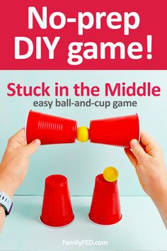 two hands holding red cups with the words, no prep diy game stuck in the middle