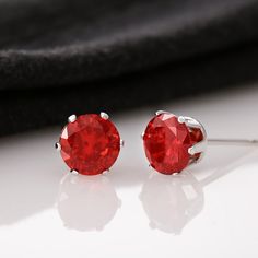 6mm red Cubic Zirconia stud earrings, with 14K white gold dipped settings & post. Red Studs, Stud Style, Solitaire Studs, Cubic Zirconia Earrings, Red Earrings, Zirconia Earrings, Gold Dipped, Red Crystals, Ruby Red