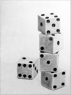 four dices stacked on top of each other in the shape of a tower with black dots