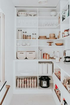 an organized pantry with lots of items on the shelves