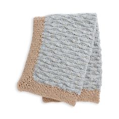 two knitted blankets sitting on top of each other